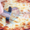 Slice of pizza with cutter
