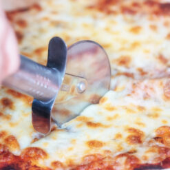 Slice of pizza with cutter