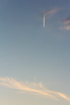 Airplane in the sky at sunset