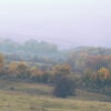 Fall landscape with haze over the hills