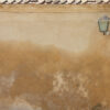 Weathered wall with a lamp