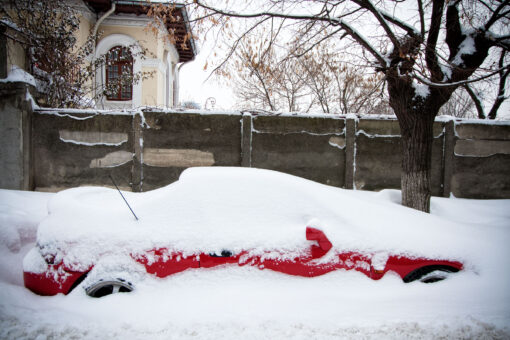 red car under snow