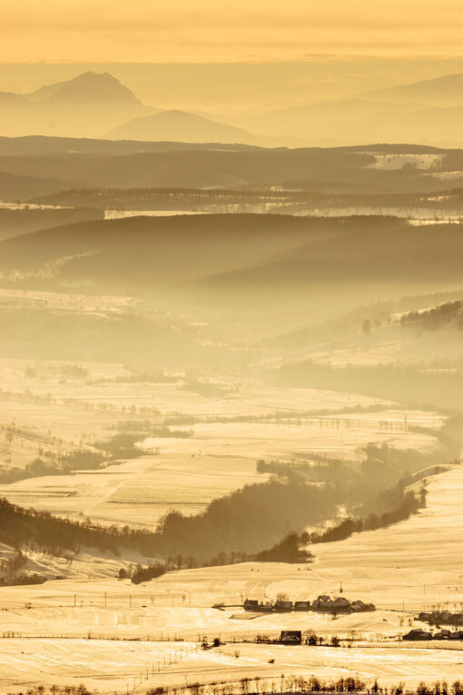 Winter landscape with hills rolling in the distance