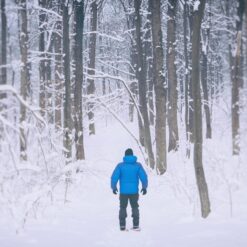 Young man snowshoeing