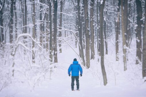 Young man snowshoeing