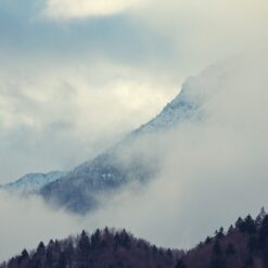 Mountain with trees and clouds